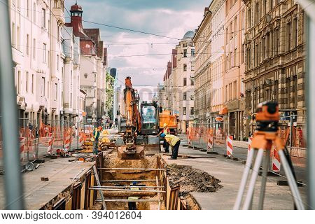 Riga, Latvia - June 9, 2019: Workers Are Engaged In Repairing Communications On The Aleksandra Caka 