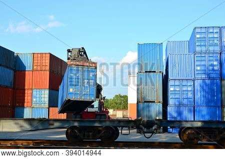 Shipping Container Loading By Richtracker On The Freight Rail Car At Logistic Warehouse Port. Ocean 