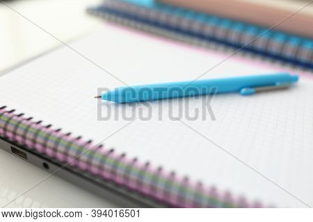 On Table Is Notebook And Blue Pen. Learning Professions Remotely Concept