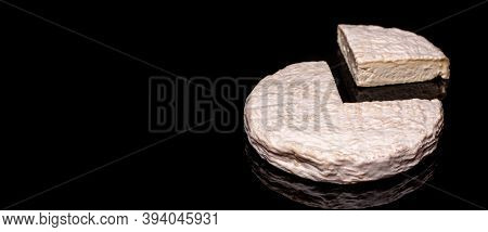 Delicious Brie Cheese Isolated On Black Reflective Background. Brie Type Of Cheese. Camembert. Fresh