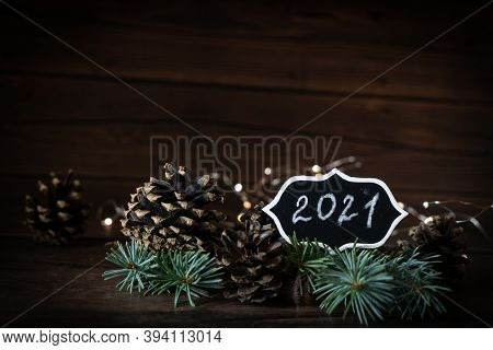 2021 New Year's Eve Bokeh, Pine Cones Composition With Text Mock-up Evening Dark Flashlights, Christ