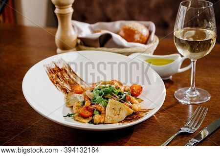 Fresh Salad Plate With Shrimp, Tomato And Mixed Greens On Wooden Background Close Up. Healthy Food.h