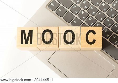 Word Mooc. Wooden Small Cubes With Letters Isolated On White Background With Copy Space Available. B