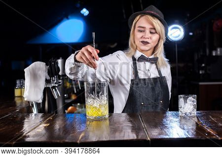 Girl Bartender Concocts A Cocktail On The Beerhall
