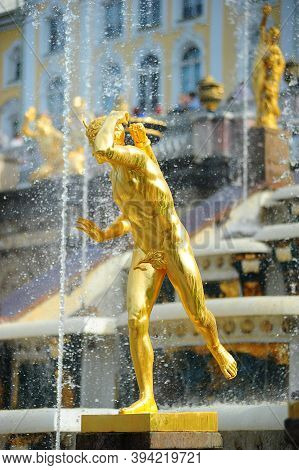 A Golden Statue At Lower Garden In Peterhof Palace, Saint Petersburg, Russia. The Peterhof Museum Is
