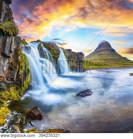 Fantastic View On Kirkjufellsfoss Waterfall  Near Kirkjufell Mountain At Sunset.  Location: Kirkjufe