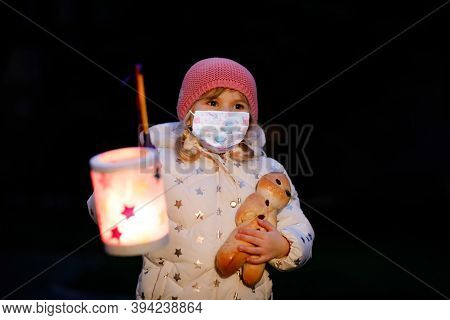 Toddler Girl Holding Selfmade Lantern For St. Martin Procession. Child Wear Medical Mask. Children A
