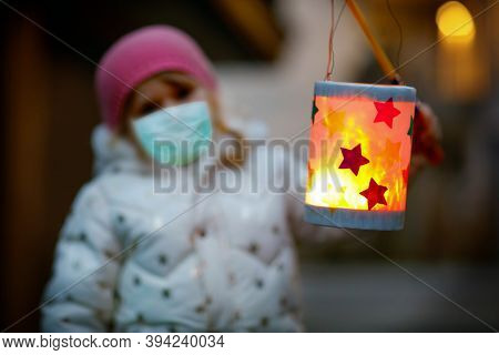 Toddler Girl Holding Selfmade Lantern For St. Martin Procession. Child Wear Medical Mask. Children A