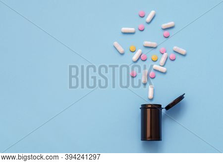 Opioid Epidemic, Painkillers And Drug Abuse Concept With Close Up On A Bottle Of Prescription Drugs 