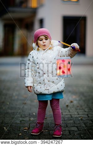 Little Kid Girl Holding Selfmade Lanterns With Candle For St. Martin Procession. Healthy Cute Toddle