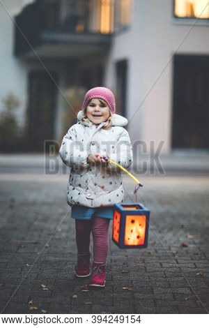 Little Kid Girl Holding Selfmade Lanterns With Candle For St. Martin Procession. Healthy Cute Toddle