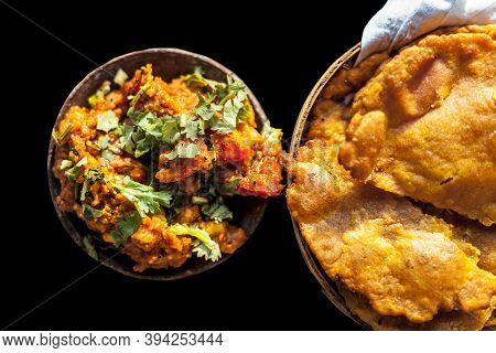 Close Up Shot Of Batate Ki Sukhi Bhaji Or Potato Sabji In A Clay Bowl Along With Some Dry Plain Frie