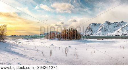 Winter Scenery With Frozen Fjord On Vestvagoy Island At Sunset With Snowy  Mountain Peaks Near Valbe