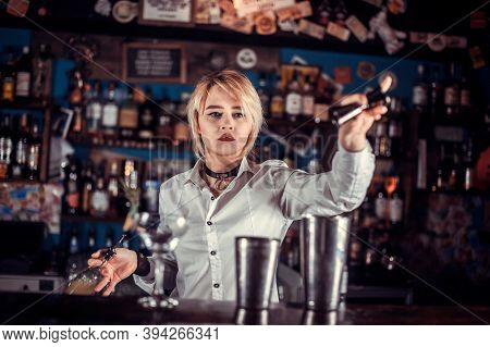 Girl Barman Makes A Cocktail At The Brasserie