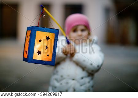 Close-up Of Little Kid Girl Holding Selfmade Lanterns With Candle For St. Martin Procession. Healthy
