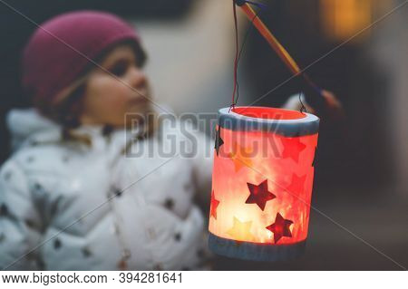 Close-up Of Little Kid Girl Holding Selfmade Lanterns With Candle For St. Martin Procession. Healthy