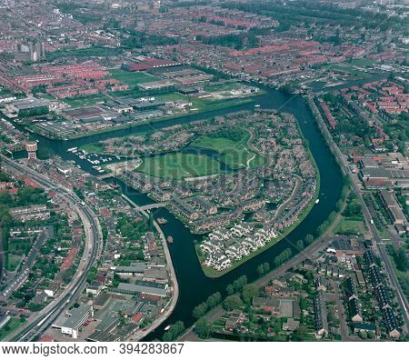 Leiden, Holland, May 17 - 1985: Historical aerial photo of the Waard eiland, a green and recreational residential island  