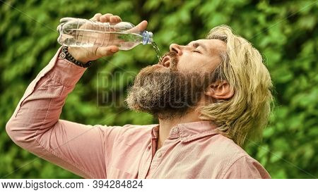 Clear And Fresh. Bearded Mature Man Drinking Water. Fresh And Healthy Water From Bottle. Healthcare 
