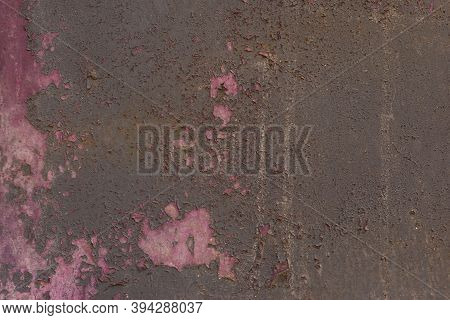 Surface Of Rusty Iron With Remnants Of Old Paint Texture Background