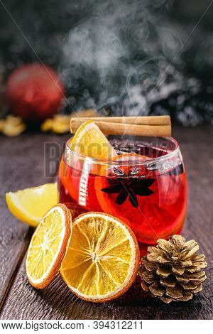 Hot Winter Drink, With Smoke And Steam, Hot Christmas Wine, Drink With Cinnamon, Wine And Citrus Fru