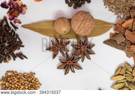 Different Spices And Herbs In A Plate, Close Up, Top View. Assortment Colorful Spices, Seeds And Her
