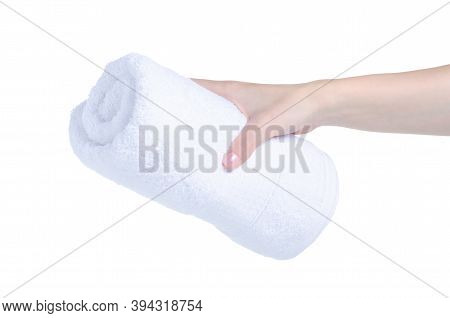 Rolled White Towel In Hand On White Background Isolation