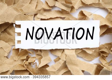 Novation, Text On White Paper With Torn Paper Background