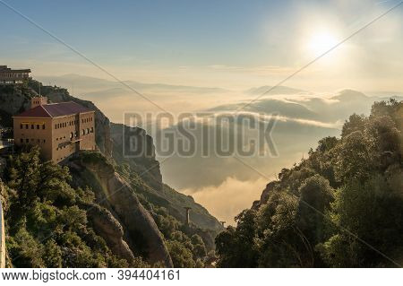 Barcelona, Spain - Feb 23, 2020: Sunrise Above Sea Of Clouds View From Montserrat In Winter
