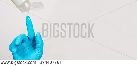 Applying The Lubricant Of Vaseline On The Blue Glove Before The Rectal Examination Of The Rectum And