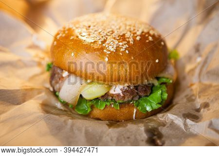 Very Ugly Cheeseburger With Bacon On Baking Paper