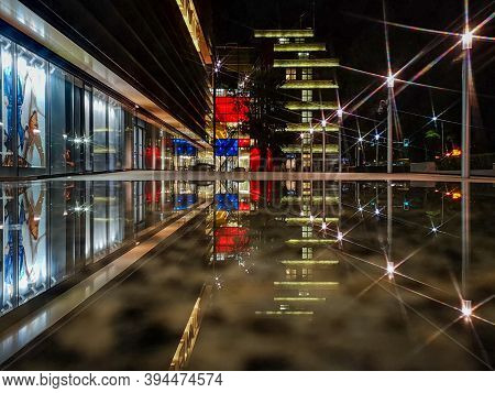 Wroclaw October 10 2019 Renoma Mall Reflected In Puddle At Night With Star Lights