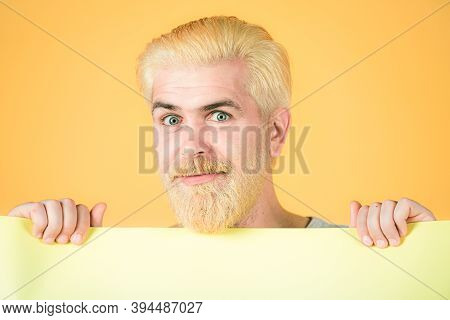Man With Blank Advertising Board On Color Background. Man Holding Big Sign Board. Copy Space For Adv