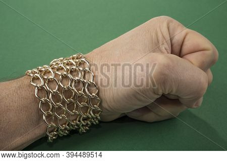 Gold Chain Around The Male Wrist. Welth Concept