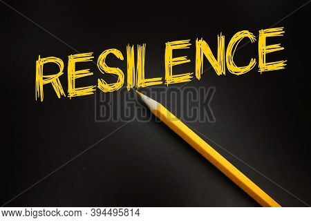 Resilence Word And Yellow Pencil On Black. Business Environment Concept