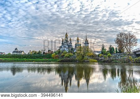 The Water Of The Rostavitsya River Reflects The Christian Orthodox Church Of St. Eugene And With A B