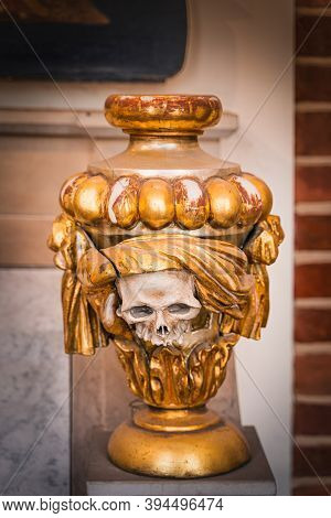 Szczecin, Poland, June 2019 Skull Ceremonial Urn, Worn And Broken, On Pedestal In The Cathedral Basi