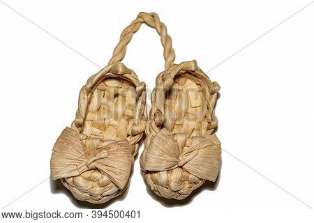 Bast Shoe On A White Background, Two Wicker Bast Shoes Tied Together.