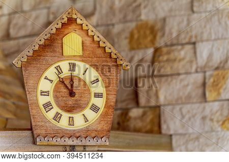 Old Clock On A Wooden Light Wall. Vintage Clock. Cuckoo Clock. Copy-space.