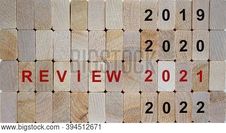 Business Concept Of Planning 2021. Wooden Blocks With The Inscription 'review 2021'. 2019, 2020, 202