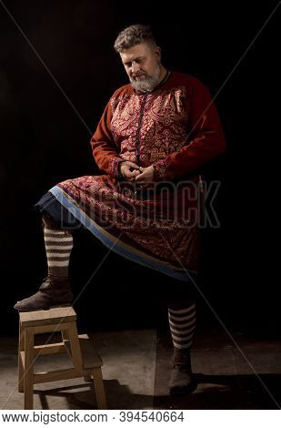 Mature Bearded Man In Traditional Historic Clothes