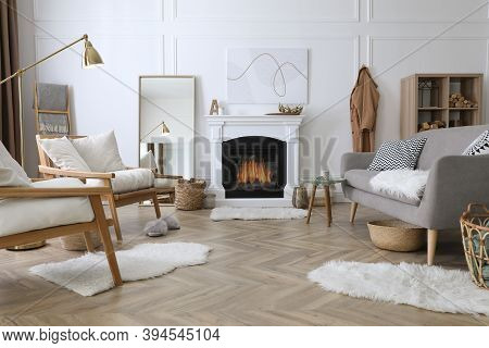 Beautiful Living Room Interior With Fireplace And Armchairs