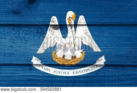 Lousiana Flag Painted On Old Wood Plank Background. Brushed Natural Light Knotted Wooden Board Textu