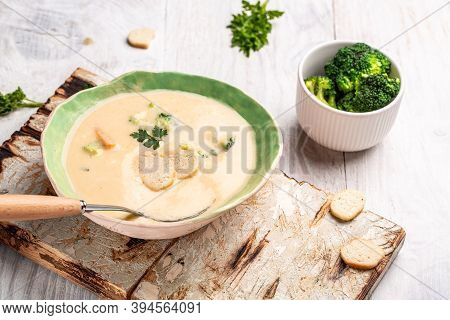 Fresh Broccoli Soup With Croutons And Herbs, Food Recipe Background. Close Up.