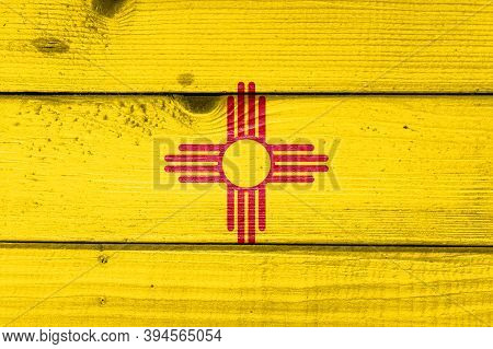 New Mexico Flag Painted On Old Wood Plank Background. Brushed Natural Light Knotted Wooden Board Tex