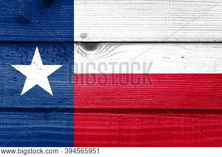 Texas Flag Painted On Old Wood Plank Background. Brushed Natural Light Knotted Wooden Board Texture.