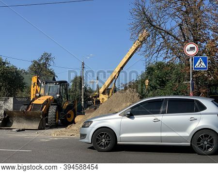 Road Works On The Roadway. Road Repair At The Crossroads. Construction Work Is Carried Out With The 