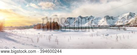 Winter Scenery With Frozen Fjord On Vestvagoy Island At Sunset With Snowy  Mountain Peaks Near Valbe