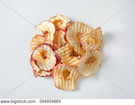 Heap of dried apple slices - apple chips or rings