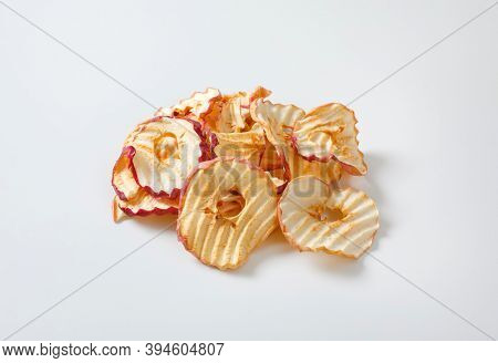 Heap of dried apple slices - apple chips or rings