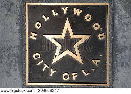 Hollywood, City of L.A. Brass Placard in the cement sidewalk. A brass Star Placard documenting Hollywood, California in the sidewalk. Hollywood is full of interesting people and things to see.